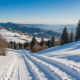 Tuscany snowy landscape with snowshoes, winter hiking trails